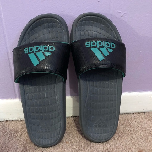 green and black adidas slides